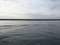 Movement of water entering the port after the passage of a ship. Boat wake. Maritime and industrial background