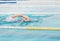 Movement of woman athletic swimming front crawl during competition