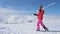 In Movement A Woman Skier Go On The Slope Mountain, Ski On Her Shoulder