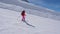 In Movement, Woman Skier Skiing Down The Slope Of The Mountain On Skis