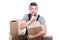 Mover guy holding cardboard box making silence gesture