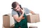 Mover guy holding cardboard box talking at phone