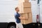 Movers Carrying Heavy Large Box Stack