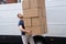 Movers Carrying Heavy Large Box Stack