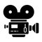 Movie camera solid icon. Retro cinema vector illustration isolated on white. Film camera glyph style design, designed