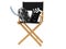 Movie director chair with film reel and clapboard