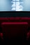 Movie screen and red chairs inside of a cinema