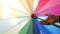Moving background of colored stripes of a multicolored umbrella 2.