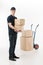 Moving boxes. Full length of young deliveryman holding a stack o