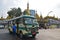 A moving bus and a pedestrian in front of Sule Pagoda in downtown Yangon, Myanmar