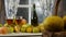 Moving camera slider showing bottle and glasses of cider with apples. In rustic house