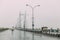 Moving cars while raining on Vidyasagar Setu Bridge, Steel Structure in the afternoon with rain in Kolkata, India