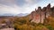 Moving clouds over autumn picturesque rock formation