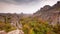 Moving clouds over autumn picturesque rock formation