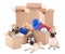 Moving day concept - brown cardboard boxes and cute dogs isolate