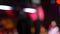 Moving defocused blinking lights on concert, abstract background