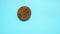 Moving and disappearing chocolate chip cookie on blue seamless background. Cookies funny stop motion. Animated chocolate cookies.