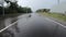 Moving on empty countryside road during heavy rain.