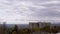 Moving Gray Cumulus Clouds Against the Background of Empty Abandoned Building