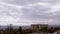 Moving Gray Cumulus Clouds Against the Background of Empty Abandoned Building