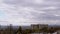 Moving Gray Cumulus Clouds Against the Background of Empty Abandoned Building