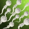 Moving group of mechanical sperm on green color background. 3d rendering. Art concept. High-quality