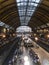 Moving inside the Luz Station, trains and passengers at the boarding and landing platforms