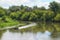 Moving on a motor boat on a river with forested coasts