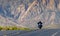 A moving motorcyclist in Red Rock Canyon, Nevada, USA