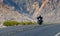 A moving motorcyclist in Red Rock Canyon, Nevada, USA