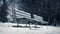 Moving Past Park Benches In Snowfall