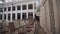 Moving shot interior of empty organ hall. Music stands and instruments on scene