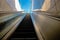 Moving stairway from underground metro and railways and open sky together with people going to metro.