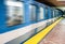 Moving subway train and Motion blur with an empty subway platform.