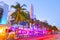 Moving traffic, Illuminated hotels and restaurants at sunset on Ocean Drive