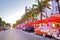 Moving traffic, Illuminated hotels and restaurants at sunset on Ocean Drive