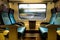 Moving train four empty coach seats blue upholstery swiss sbb rail network