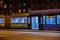 Moving tram at night. Public transport at night. Moving streetcar at night. Busy street at night