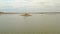 Moving view above the lake Kariba in Zimbabwe near Victoria Falls, small island with the group of Hippopotamus - Hippopotamus amph