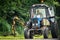 Mowing the grass along the road in the Kaluga region of Russia.