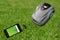 Mowing robot in the garden with smartphone control