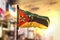 Mozambique Flag Against City Blurred Background At Sunrise Backlight