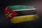 Mozambique Flag Made of Metallic Brush Paint on Grunge Dark Wall