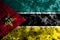 Mozambique grunge flag on old dirty wall
