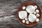 Mozzarella balls on clay dish, top view