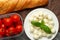 Mozzarella with basil leaves - fresh ingredients for Bruschetta, with cherry tomatoes and French baguette