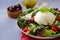 Mozzarella burrata salad with basil leaves