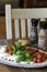 Mozzarella, Tomatoes, Basil Caprese for Lunch - salt and pepper - portrait orientation