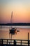 Mrning light breaks over a moored yacht at St. Michaels, Maryland, USA