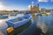 Msida, Malta - Blue traditional fishing boat with the famous Msida Parish Church